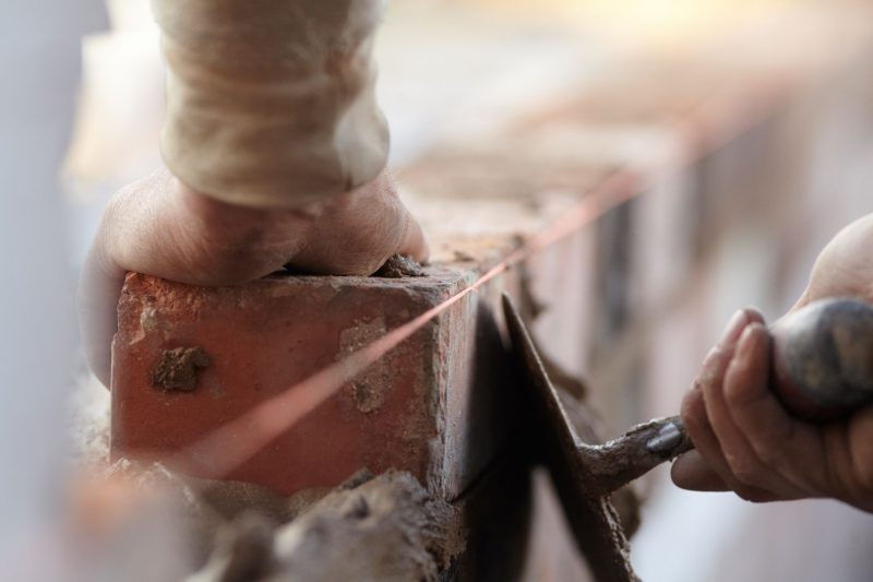 Student doing brick work