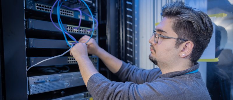 Computer student working on server